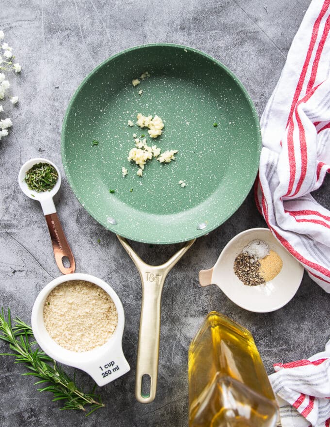 Ingredients to coat the rack of lamb including panko, olive oil. garlic, fresh rosemary and seasoning