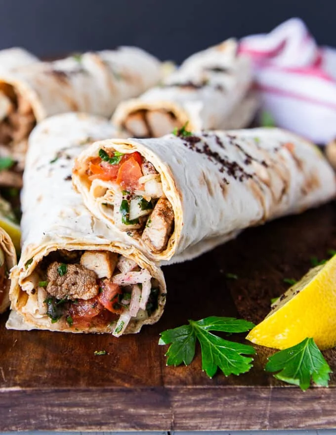 Close up of a Tantuni cut in half showing the lamb filling