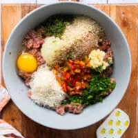 All the ingredients that were in small bowls are added to the bowl of minced beef