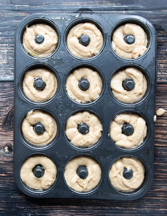 apple cider donuts recipe in a donut pan ready to bake