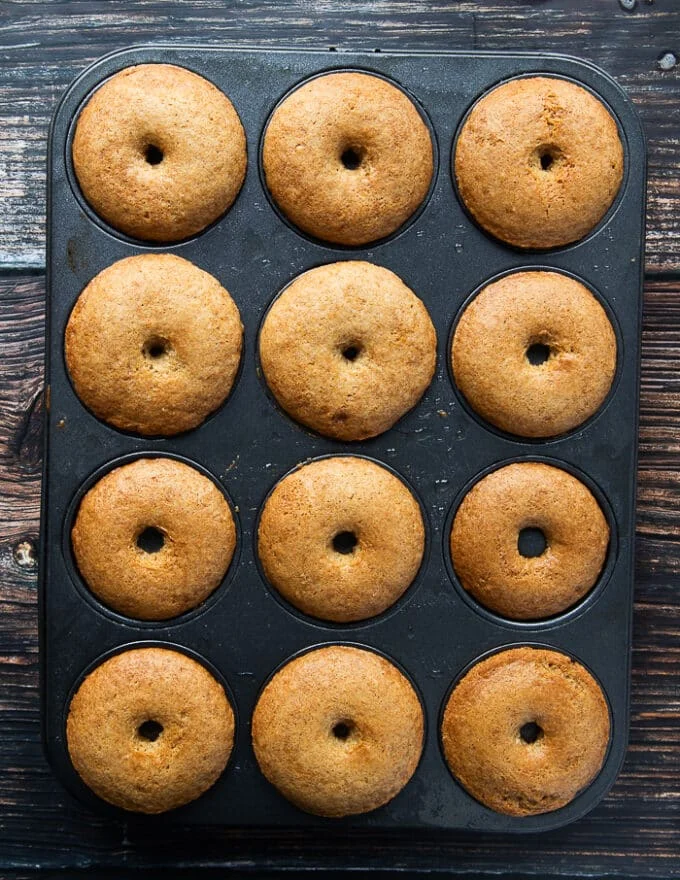 baked apple cider donuts out of the oven puffy and gorgeous