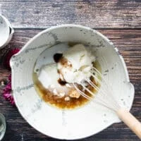 All the wet ingredients are mixed together in a large bowl to make apple cider donuts