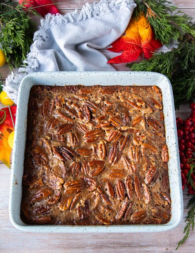 Pecan pie bars right out of the oven, they look golden and the filling has set.
