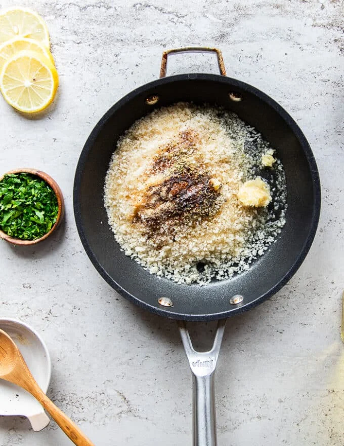 The panko coating for the baked cod is all added into a small skillet and tossed together