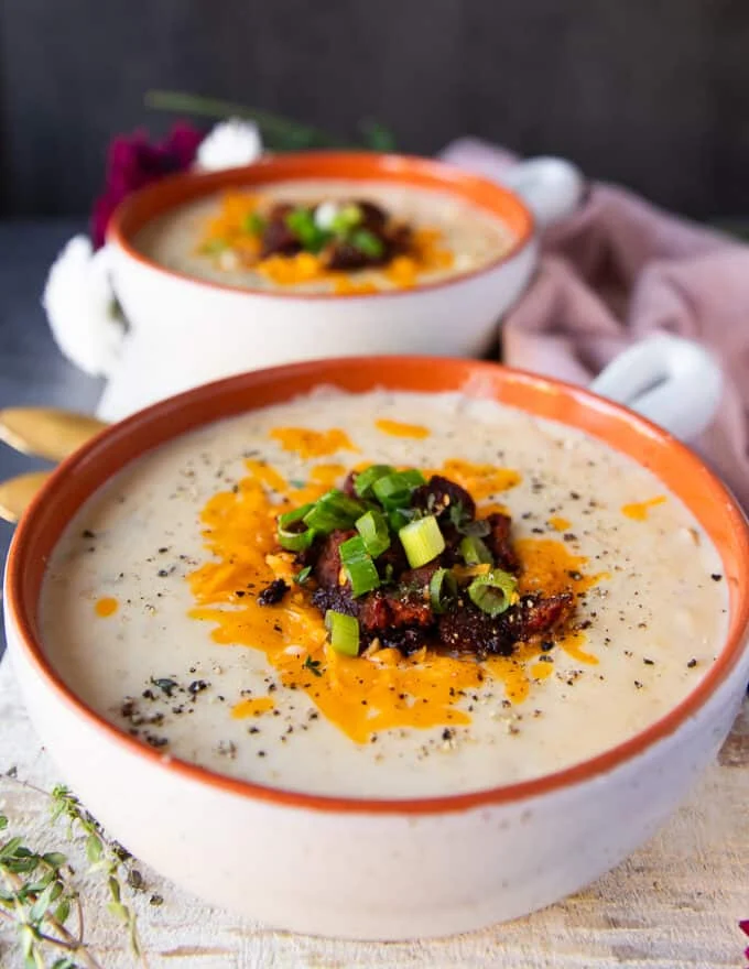 One close up bowl side view of the potato soup recipe showing close up of the toppings and textures