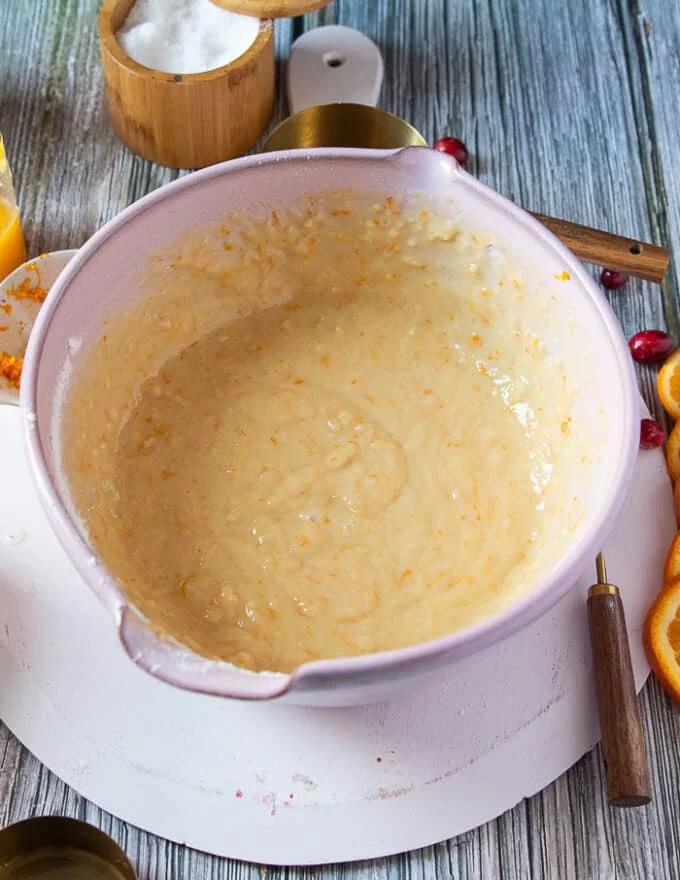 The orange cranberry batter mixed in the large bowl and ready for the cranberries