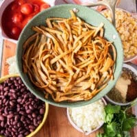 Golden fried tortilla strips a the frying pan.