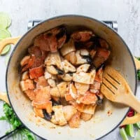 The jonah crab claws are added to the pot and tossed with the garlic butter sweet chilli sauce.
