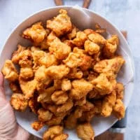 All the chicken fried and golden and placed on paper towels in a plate to drain from any excess oil