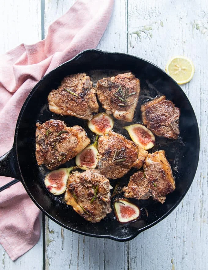Lamb loin chops flipped and golden on the top now cooking in the pan until ready