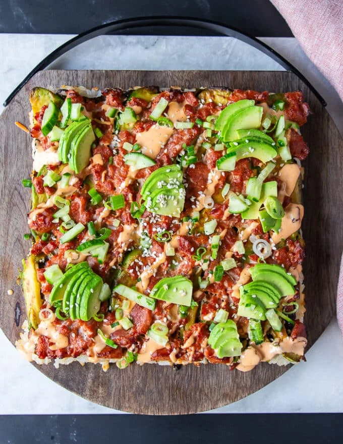 Top view of a full sushi casserole or sushi bake out of the oven and fully dressed up, ready to eat