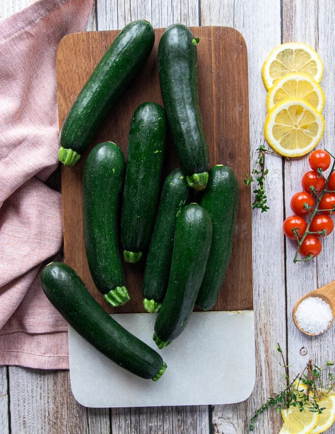 A board with a plentiful of zucchini