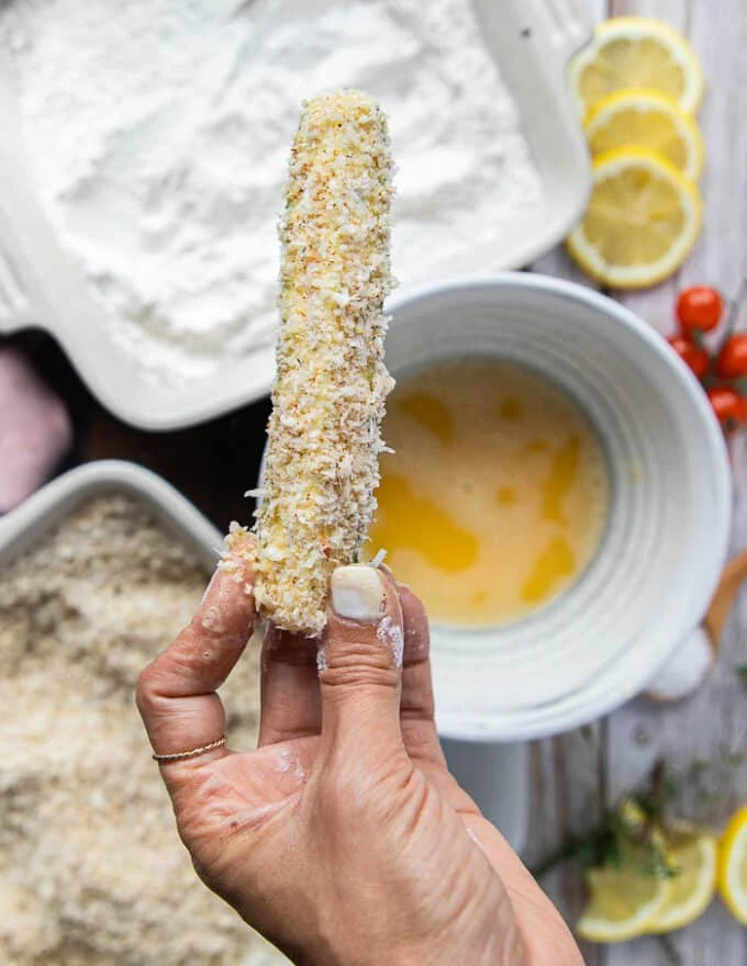 The zucchini is now coated with the final coating of panko bread crumbs and ready to bake or air fry