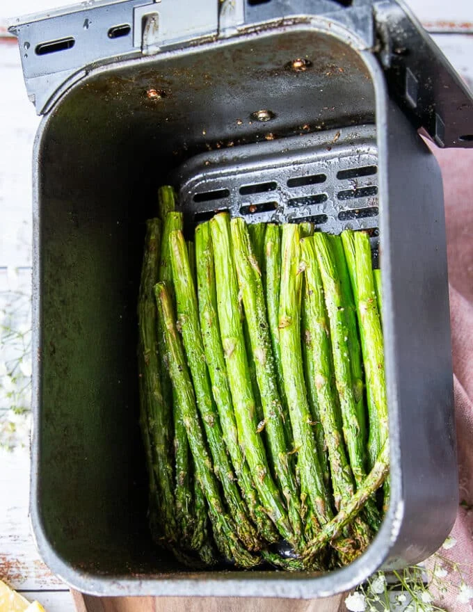 The asparagus perfectly cooked in the air fryer perfectly golden crisp and aldente on the inside