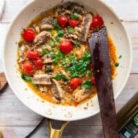Lots of fresh basil and fresh oregano added to the skillet once the sauce is finished