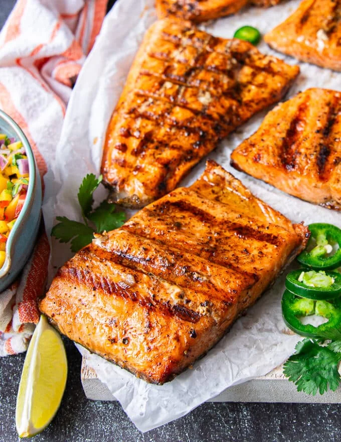 close up of grilled trout showing the grill marks and cooked fish