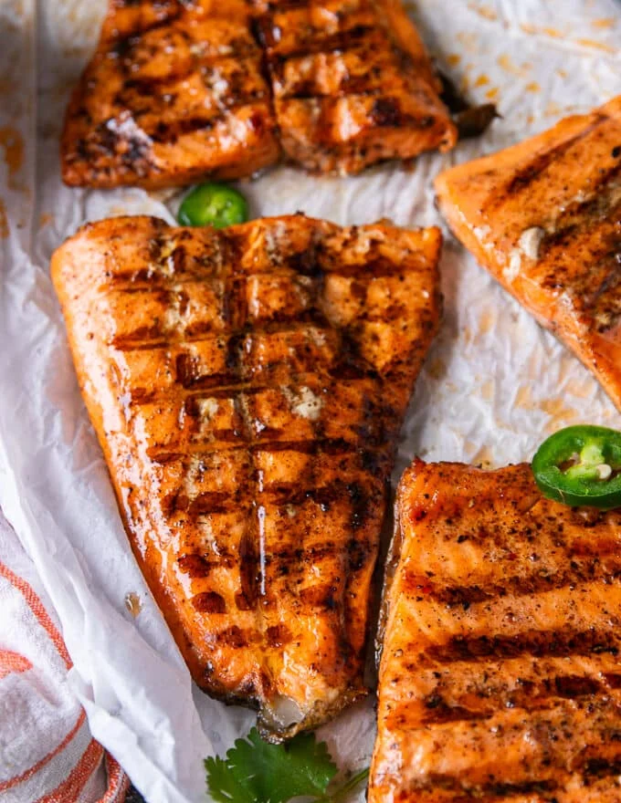 close up of the grilled trout out of the grill basket showing the beautiful grill lines and perfectly juicy fish