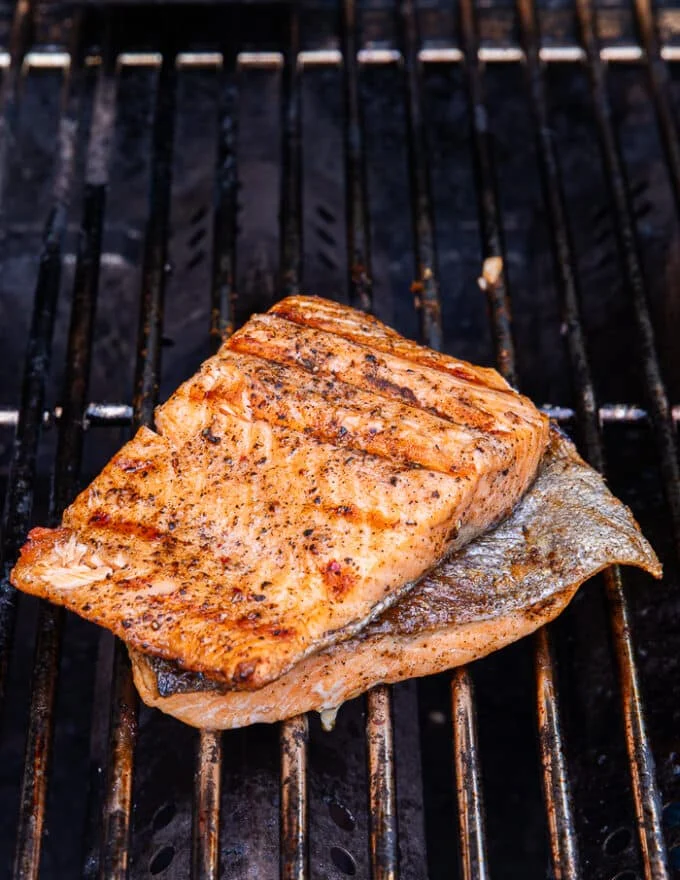 Perfectly grilled trout with grilled marks on both sides, crispy skin and succulent fish