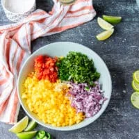 All ingredients of the mango pico de gallo added into a large shallow bowl together
