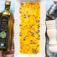 The remaining ingredients for the vinaigrette are added over the serving plate like olive oil, vinegar, capers, salt and pepper