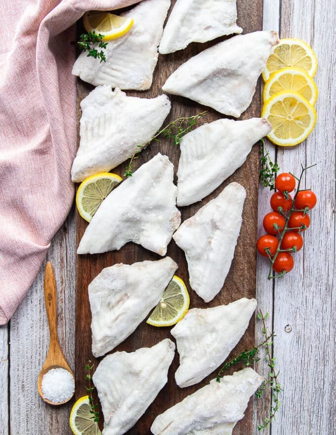 perch fillets on a wooden board showing the fish in details