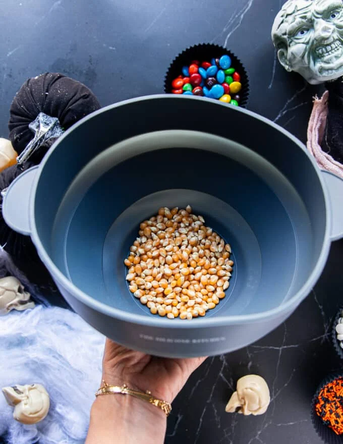 The raw kernels in a popcorn maker