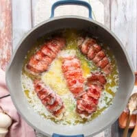lobster tails are added to the butter mixture in the saucepan