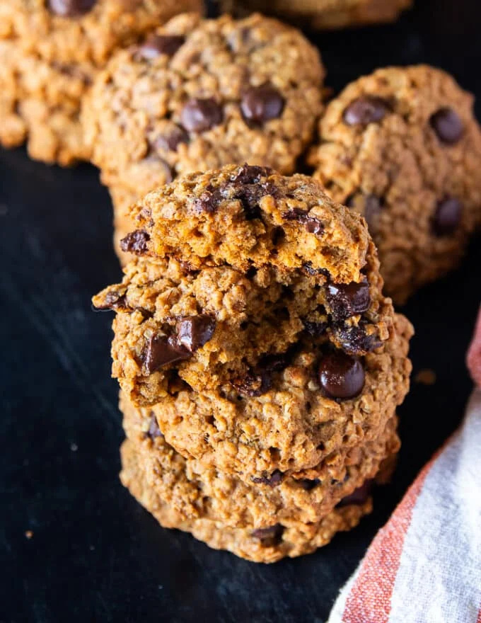 bitten pumpkin oatmeal cookies showing the texture of the inside of the chewy cookies