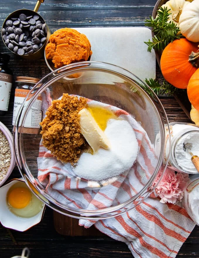 The soft butter, white sugar and light brown sugar are added to a large bowl to start creaming