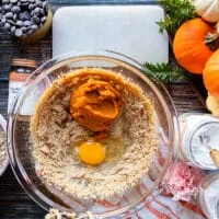 The egg yolk and pumpkin purée, pumpkin spice and vanilla are added to the bowl of butter and sugars
