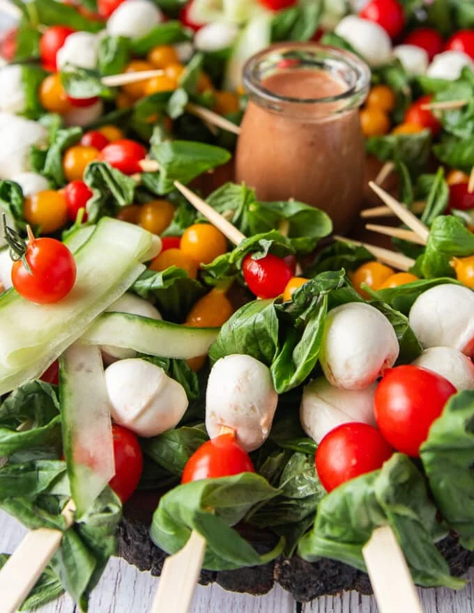 close up of one caprese skewer over the caprese wreath