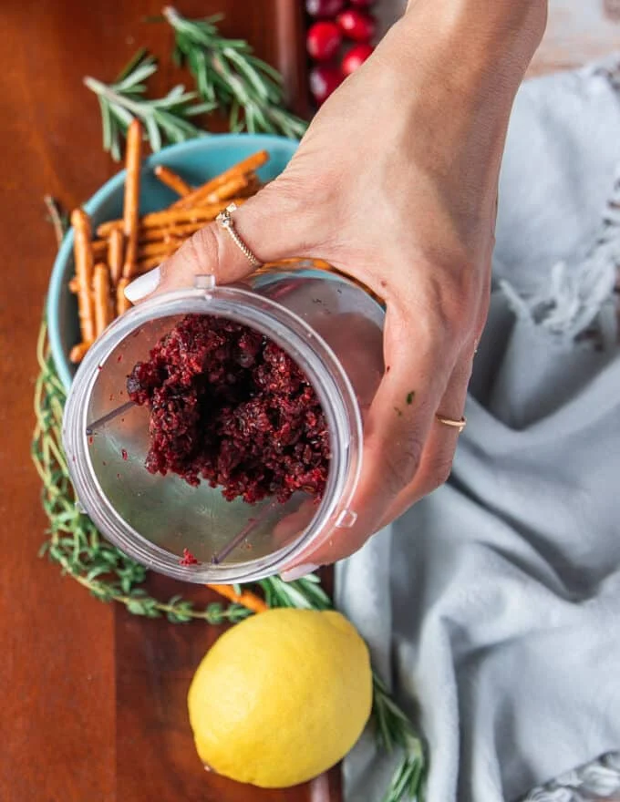 A mini processor bowl with minced cranberries