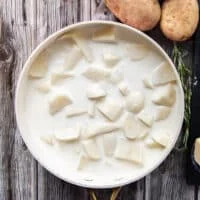 perfect amount of milk and cream added over the potatoes, not too much, just enough to cover it so it can soak it up.