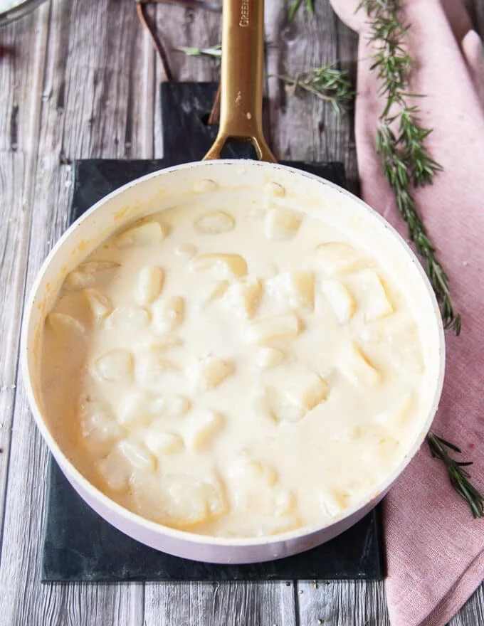 tender boiled potatoes in the pot ready to mash