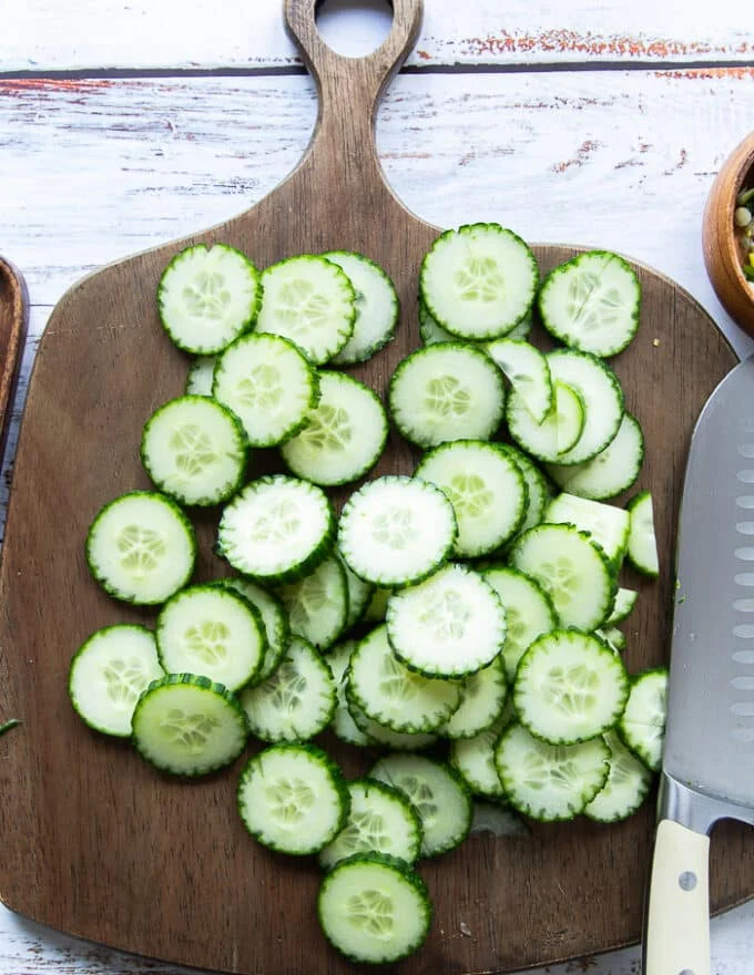 Sliced cucumbers ready on a cutting board