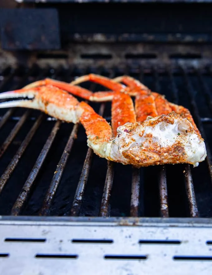 seasoned crab legs on the grill