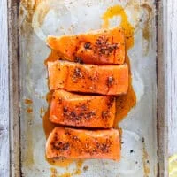marinated salmon fillets on both sides with the chili sauce ready to bake or broil