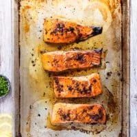 Broiled salmon with the sweet chili sauce on the baking sheet, cooked and ready