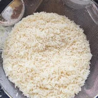 long grain basmati rice rinsed and drained in a colander