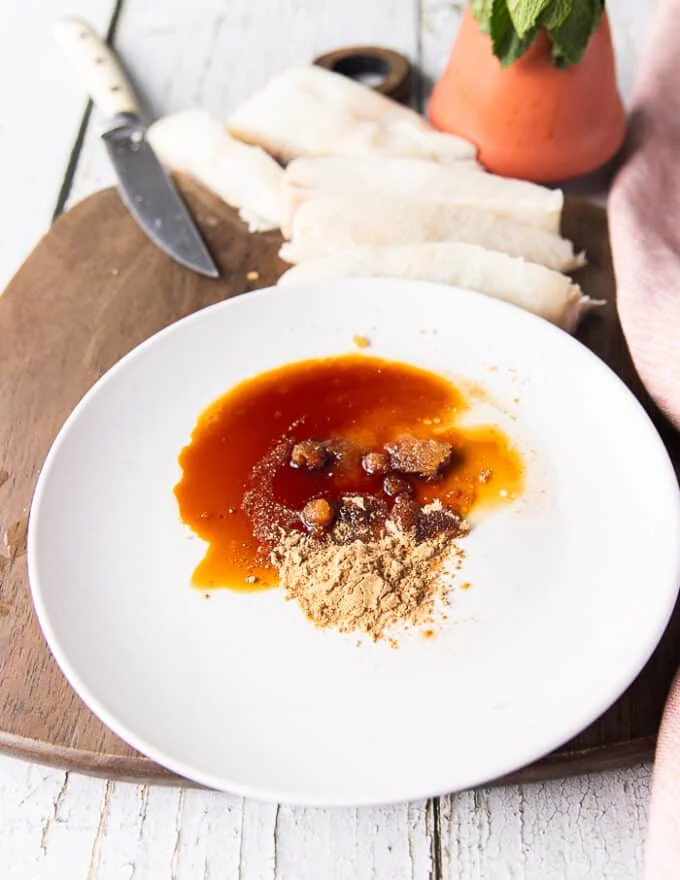 A plate with the marinade ingredients all thrown in