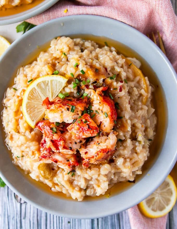 close up top view of lobster risotto plate with the chunks of lobster on top