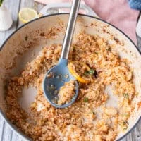 The rice is sautéed and ready in the skillet for the stock to begin adding