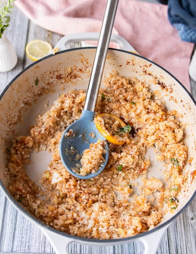 The rice is sautéed and ready in the skillet for the stock to begin adding
