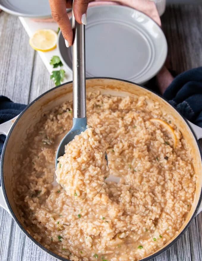 cooked lobster risotto in the skillet with the rice tender and still saucy. The lobster bits are mixed in and lemon zest and parmesan cheese