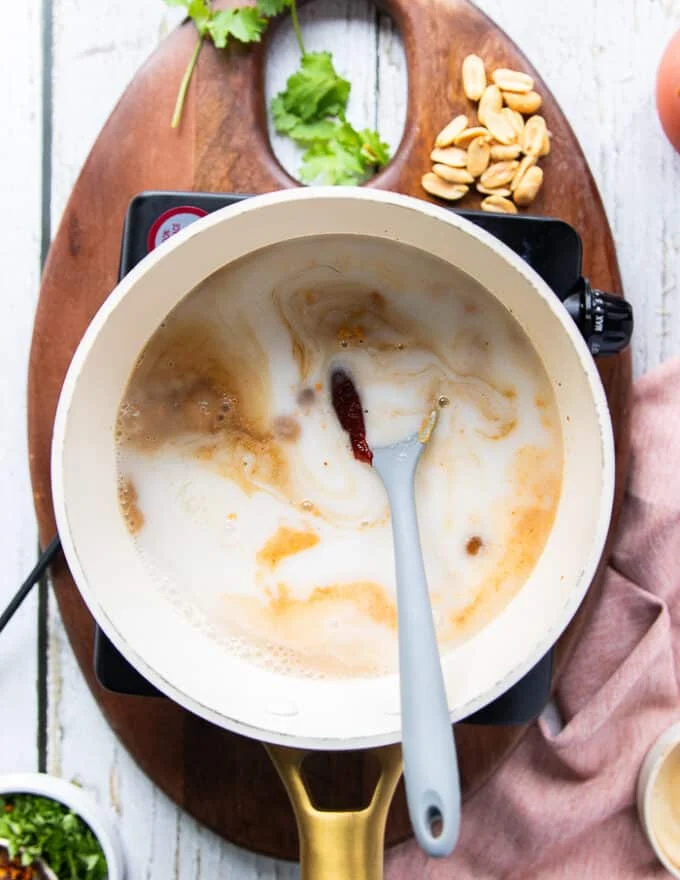 All satay sauce ingredients are added into a pot