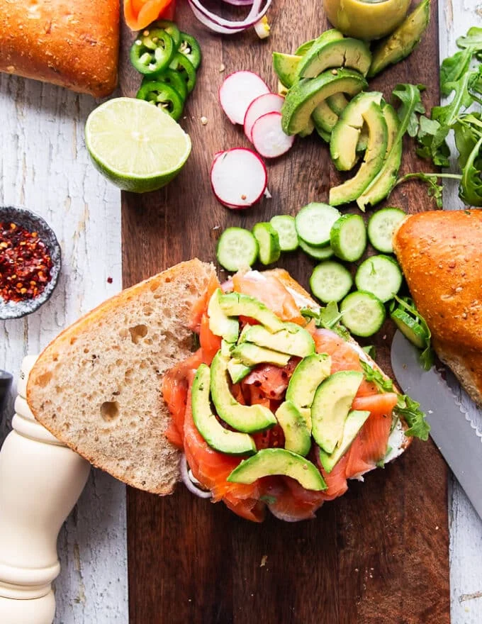 the final topping is the avocado which is placed right over the smoked salmon and now the smoked salmon sandwich is layered