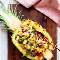 Optionally the pineapple salsa can be scooped back into the pineapple half shell for a beautiful presentation or served in a bowl