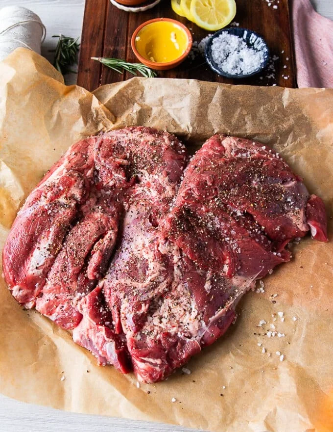 heavily salted and pepper boneless leg of lamb