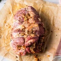 The kitchen twine is then used to tie the first knot around the circumference of the boneless leg of lamb and within every round, a knot os formed