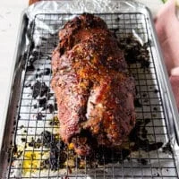 The high temperature roasting is now complete and the boneless leg of lamb has a beautiful crust and [perfect internal temperature. It is ready to rest